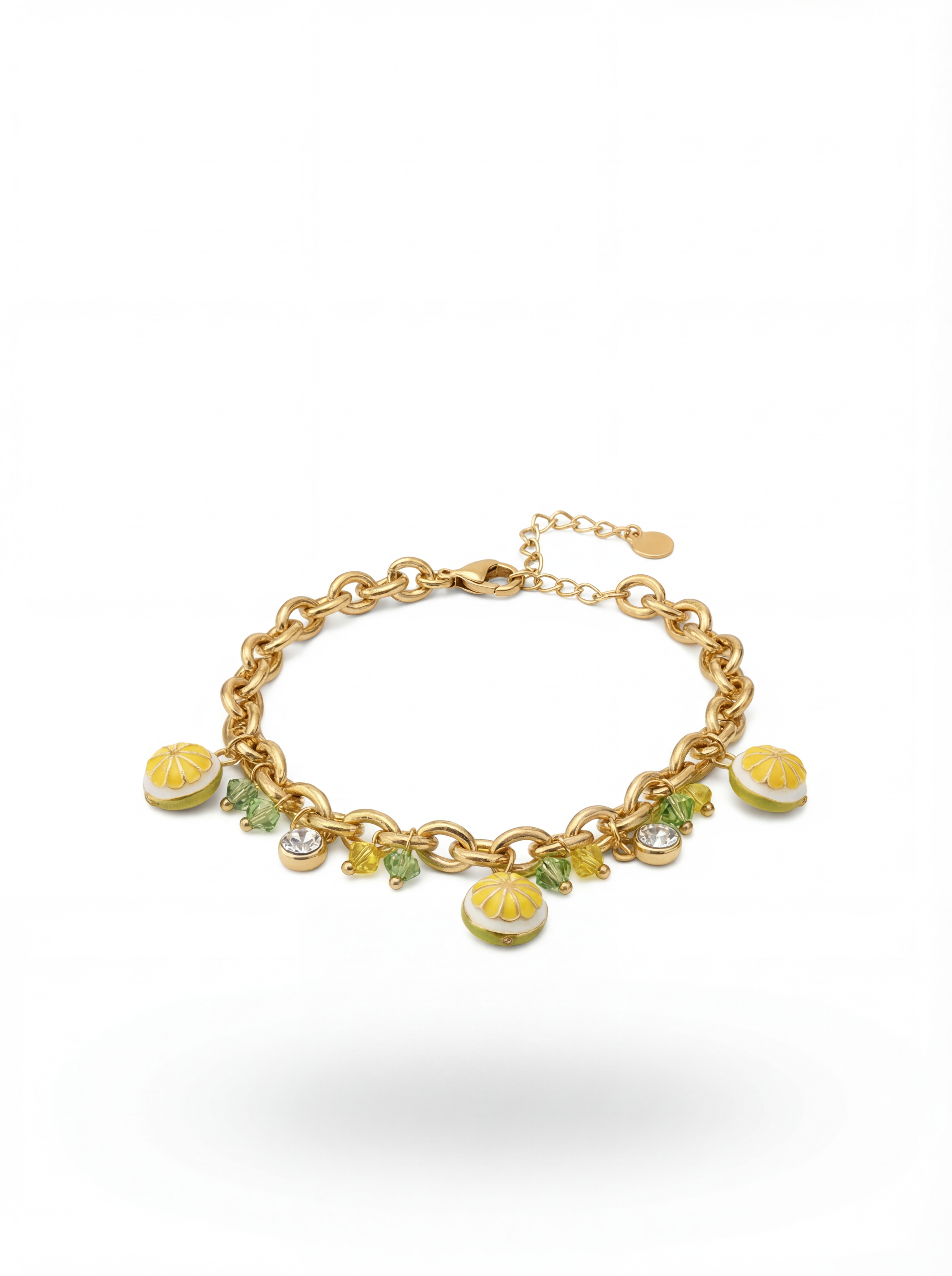 Gold bracelet with lemon charm on a white background