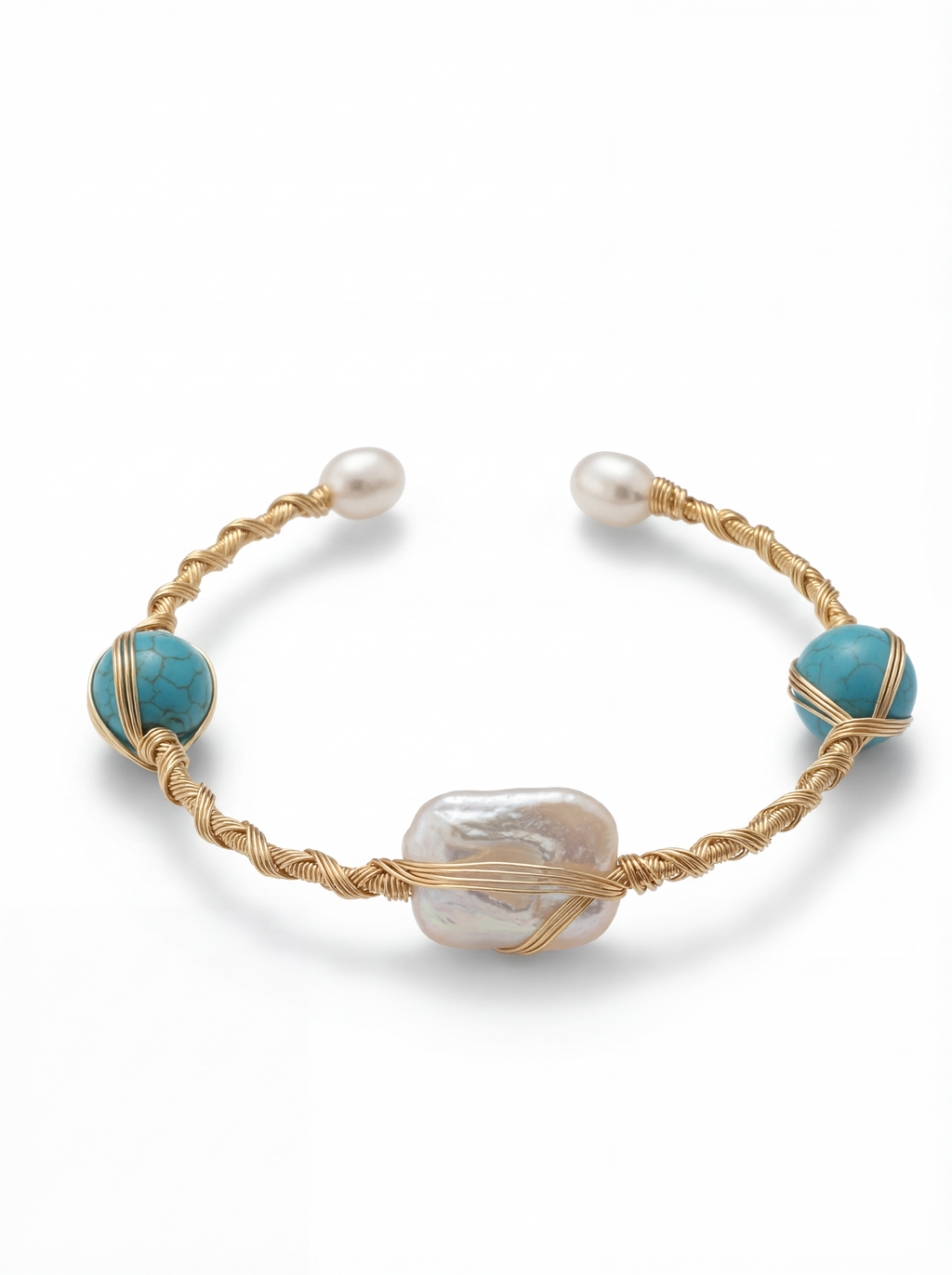 Bracelet with gold wire wrapping, turquoise beads, and pearls on a white background