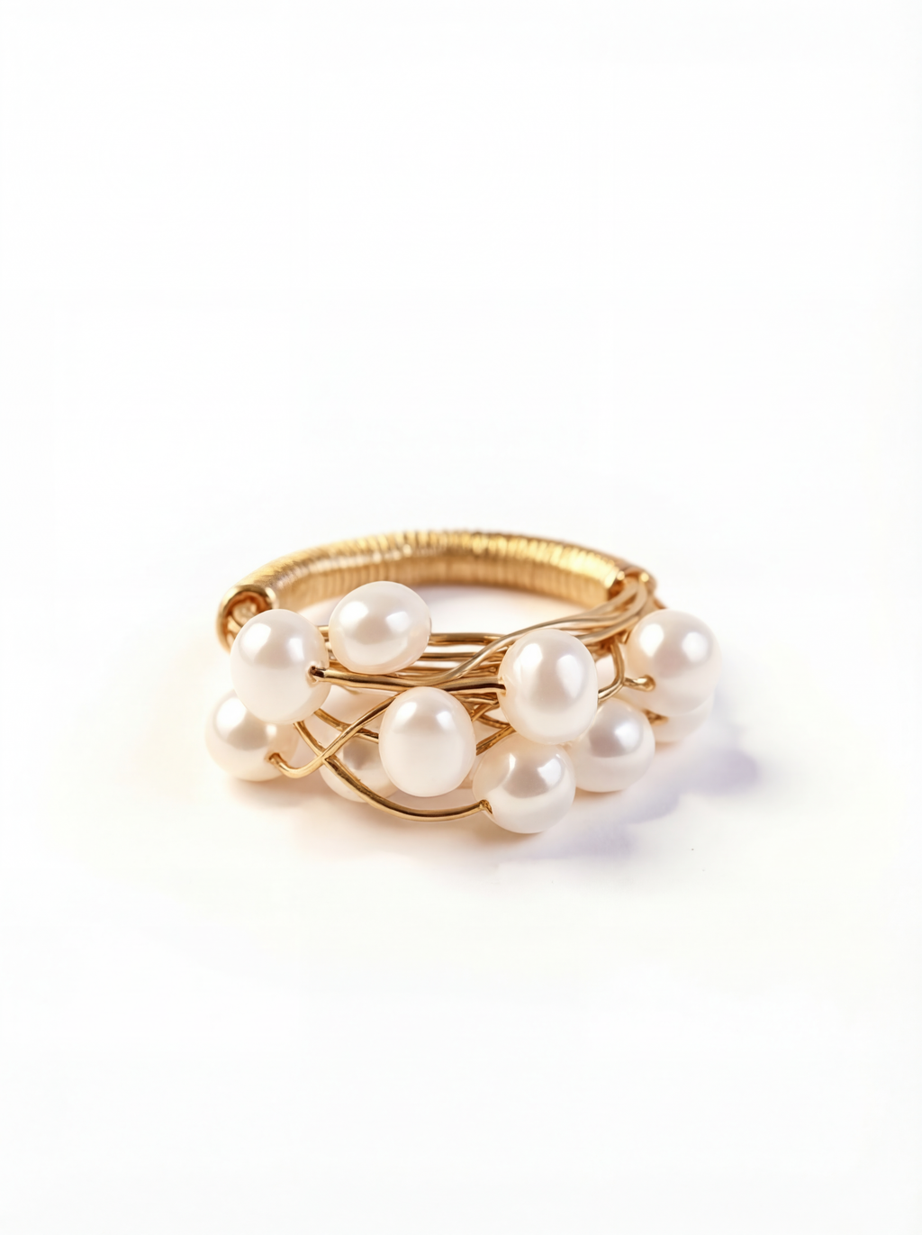 Gold ring with pearls on a white background