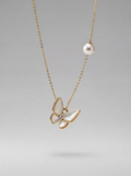 Butterfly-shaped pendant necklace with pearl and gemstone details on a gray background