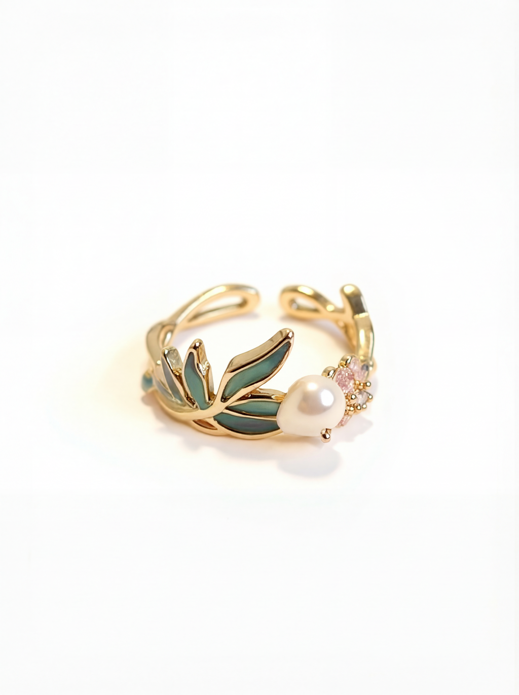 Gold ring with green leaves and a pearl on a white background