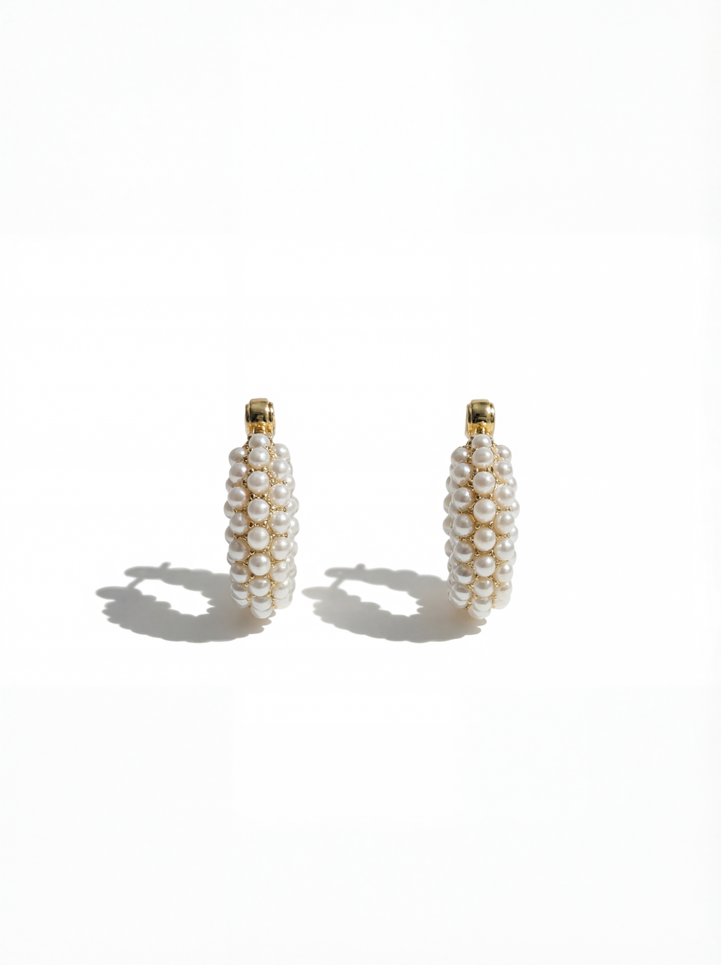 Pair of pearl earrings on a white background