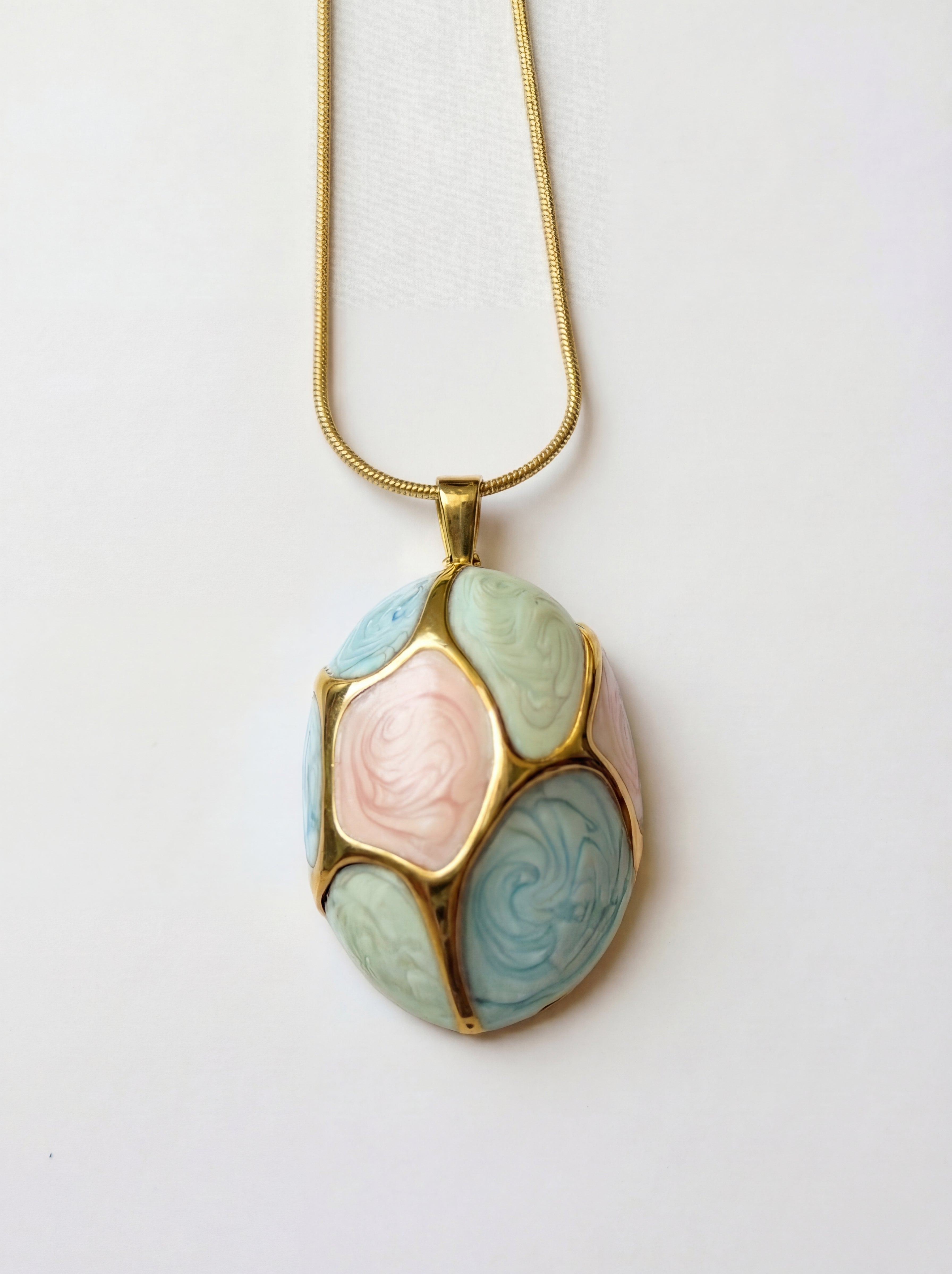 Necklace with a multicolored pendant on a white background