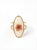 Ring with a floral design on a white background