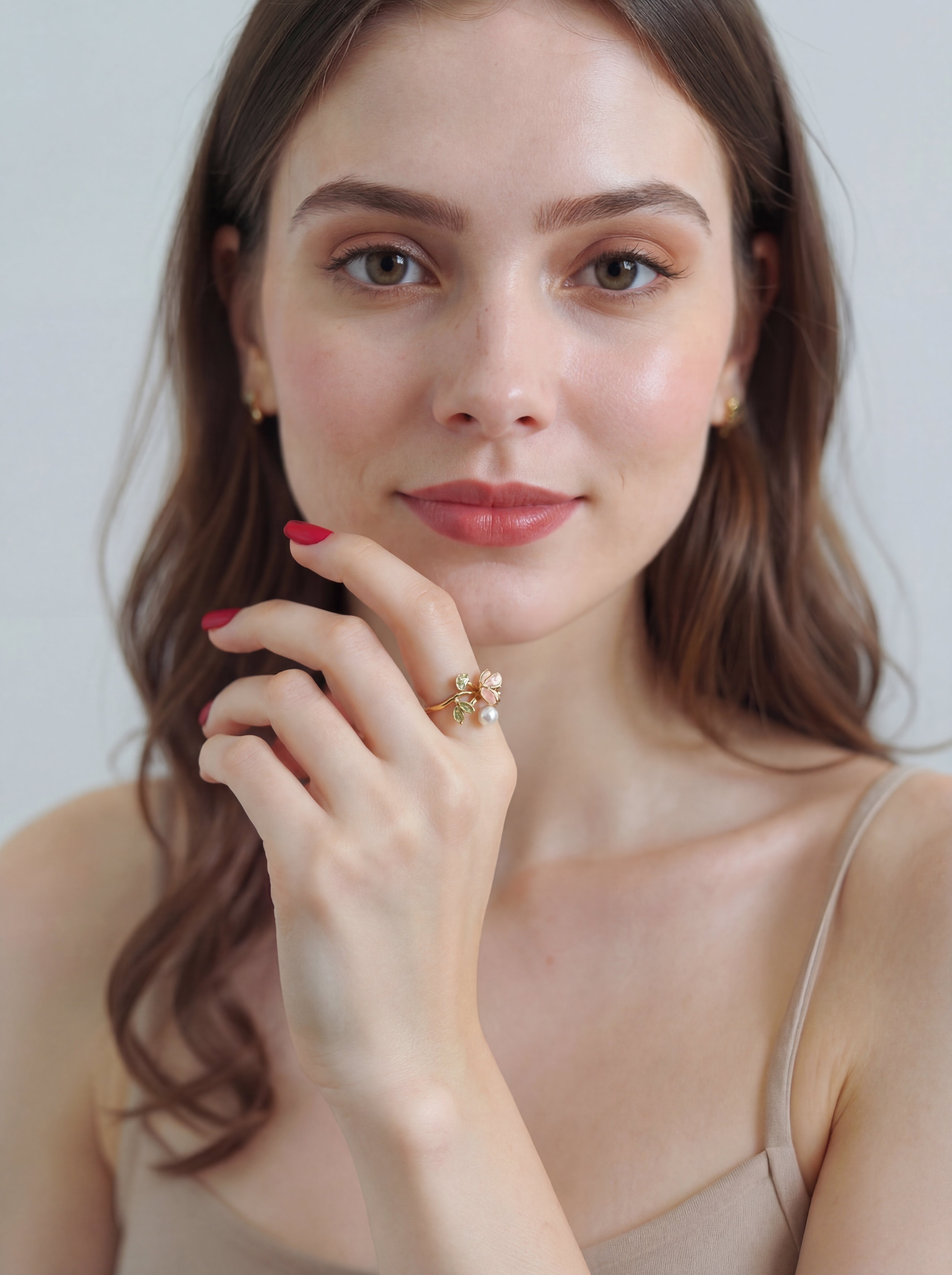 Woman wearing a ring with a white background