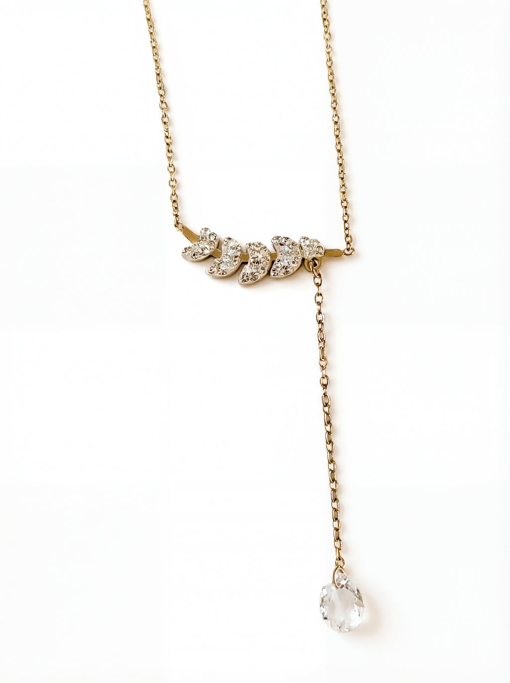 Gold necklace with diamond pendants on a white background