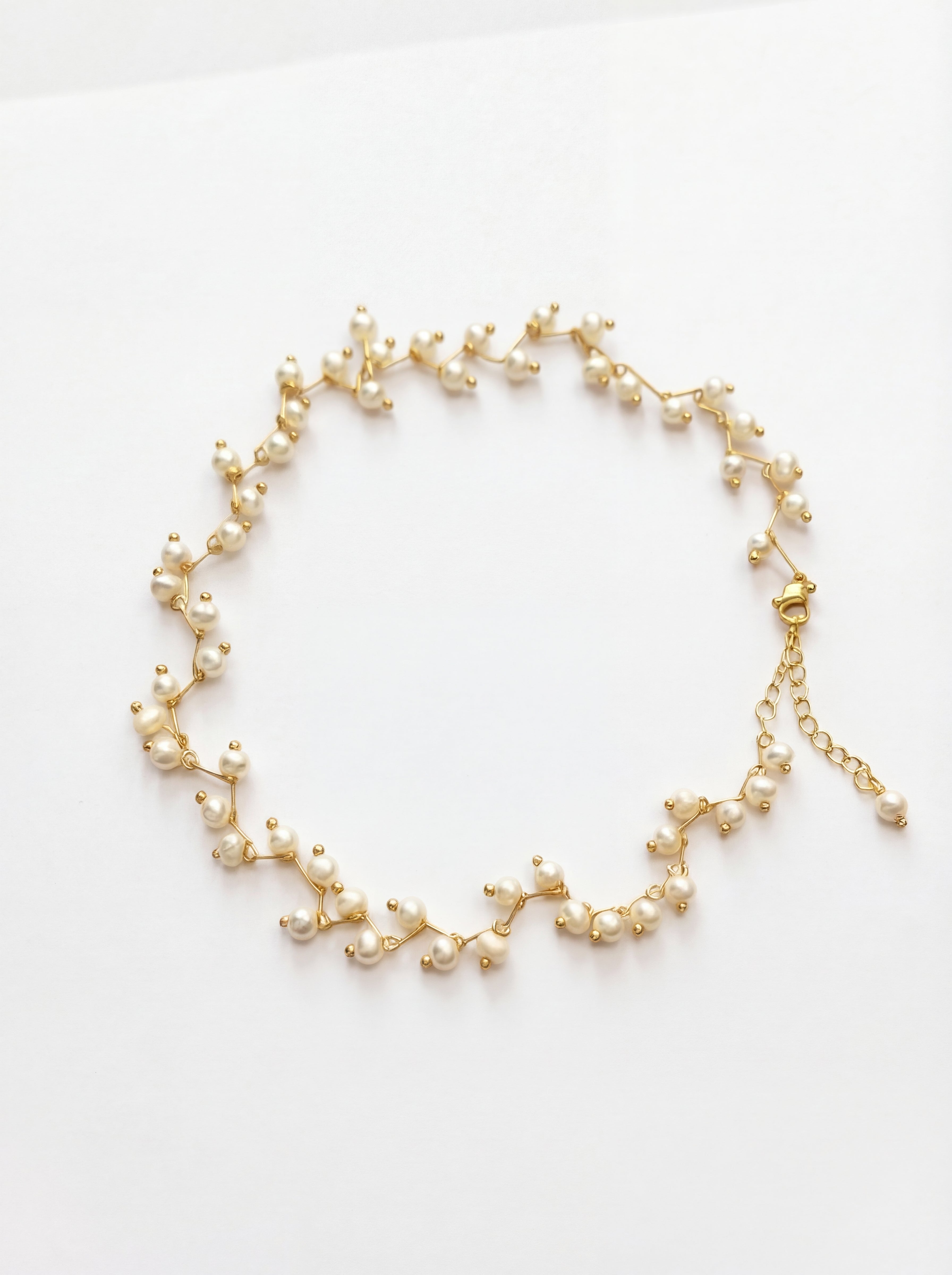 Delicate pearl necklace on a white background
