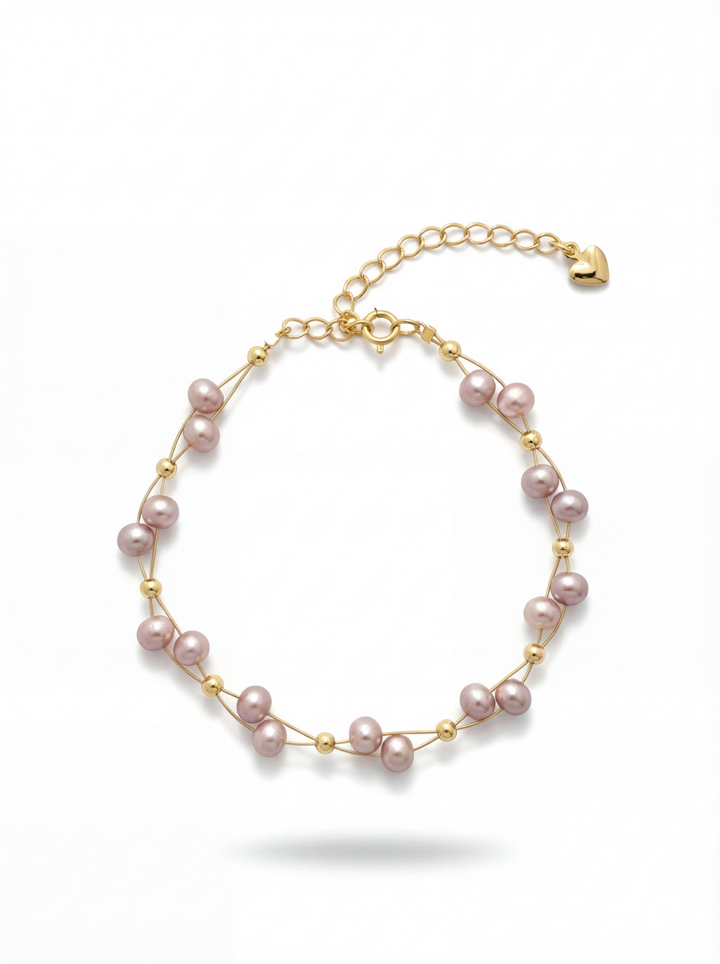 Pearl bracelet with gold accents on a white background