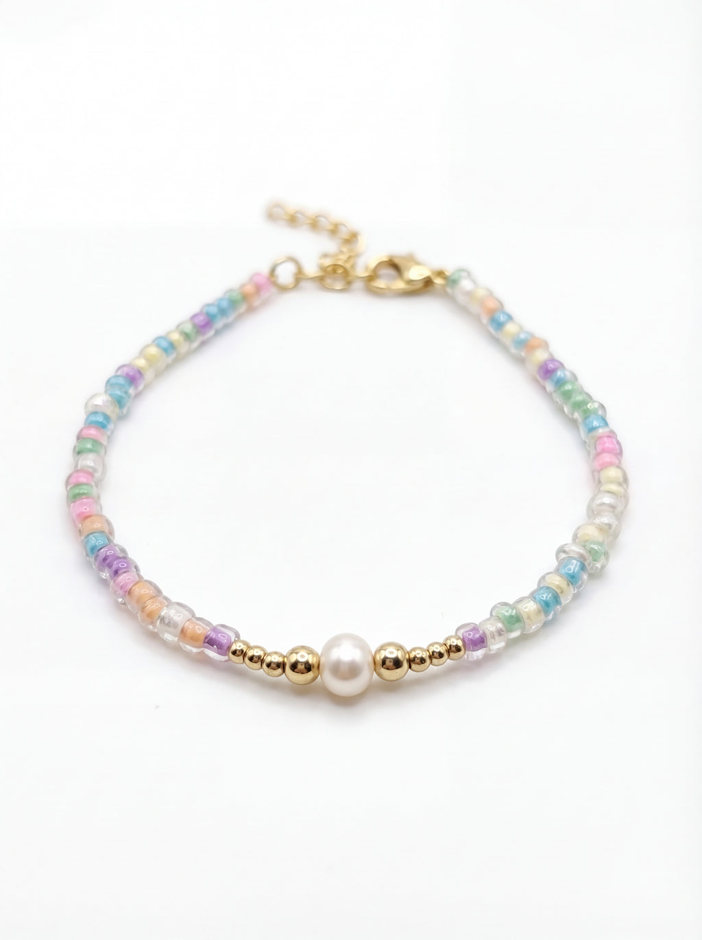 Multicolored beaded bracelet with a gold clasp on a white background